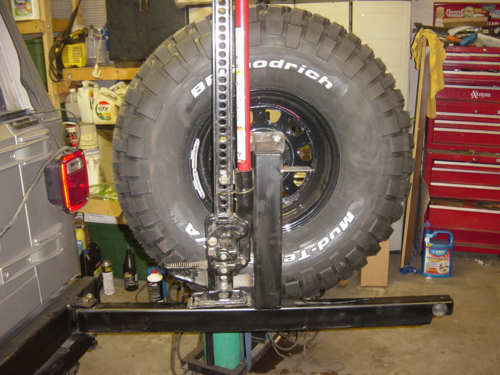 ai303.photobucket.com_albums_nn152_VortecJeep_TJ_20Build_tirecarrier1.jpg