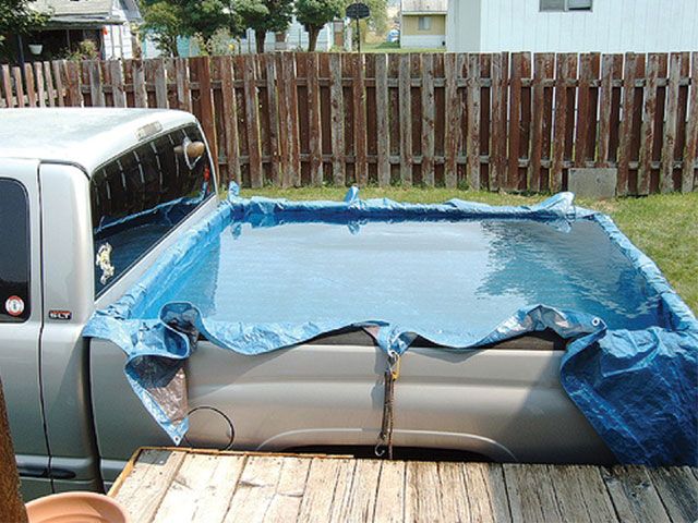 aimage.sporttruck.com_f_10533095_w750_st0_0810st_23_z_truck_bed_truck_bed_lined_with_tarps.jpg