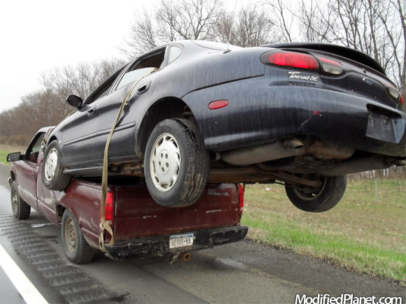 car-photo-1999-ford-taurus-on-back-pickup-truck-bed-car-fail-funny.jpg